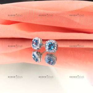 Individually Hand-crafted Pair of Silver Swiss Blue Topaz Gemstone Studs surrounded by Cubic Zirconia &amp; Rhodium.